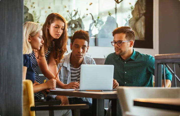 workers around laptop